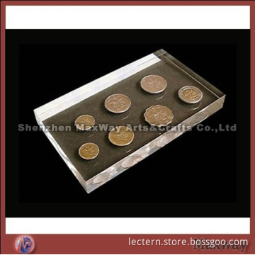 Acrylic transparent paperweight with some coins inside